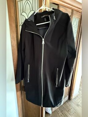 Calvin Klein Woman’s  Hooded Black Raincoat. XL